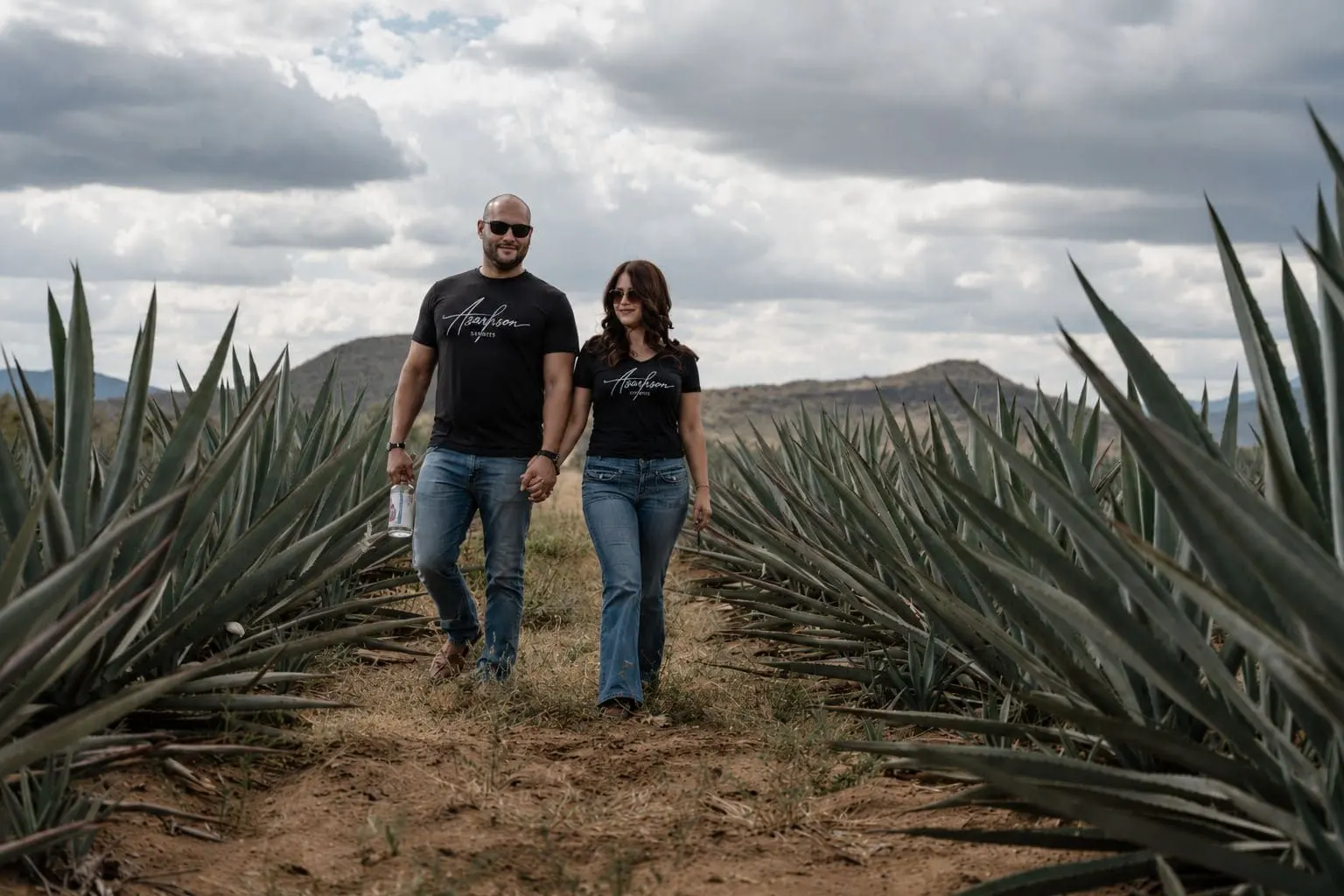 Founders walking through the agave field